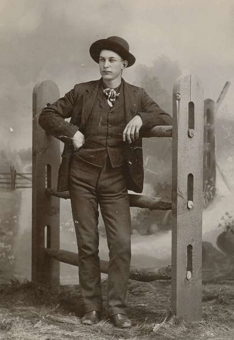 fence, painted backdrop, Portraits - Individual, man, Iowa, cabinet photo, State Center, IA, Iowa History, hat, bow tie, Olsson, Ann and Jons, history of Iowa