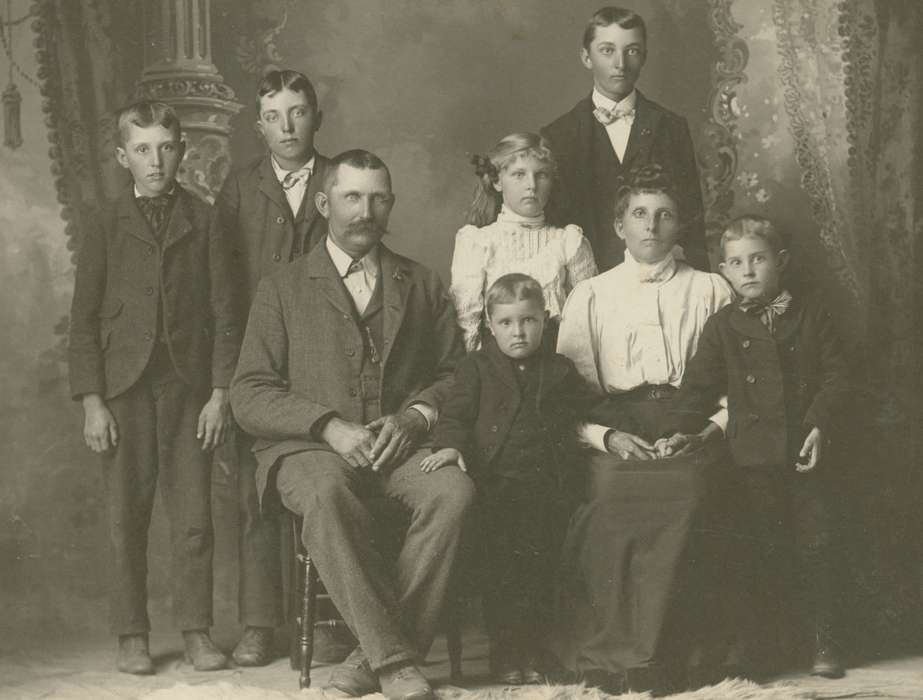 Families, Iowa History, Ihnen, Lorraine, Portraits - Group, Iowa, curtain, sack coat, pocket watch chain, IA, mustache, Children, painted background, history of Iowa