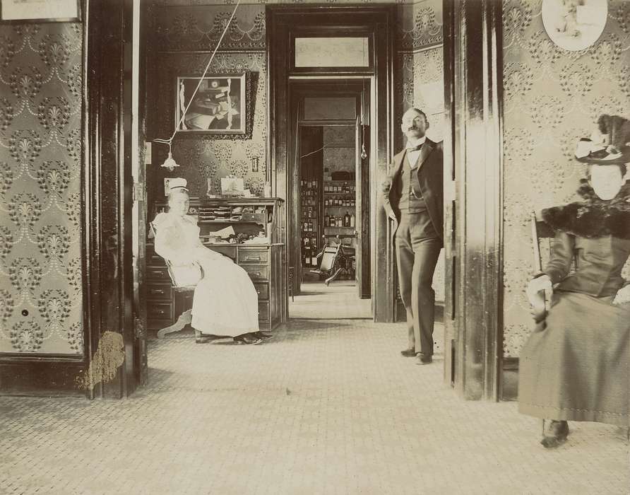 office, doctor, nurse, wallpaper, Waverly, IA, Portraits - Group, correct date needed, mustache, picture, history of Iowa, hat, waiting room, Iowa History, glasses, doorway, Iowa, dr. william a. rohlf, Waverly Public Library, dress, bottle, Hospitals