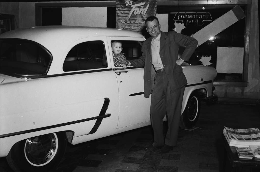 Businesses and Factories, adult man, history, toddler, Photos, Labor and Occupations, Children, suit, Iowa, salesman, IA, Motorized Vehicles, Portraits - Individual, United States, ia, car dealership, Coon Rapids Enterprise, historic, Coon Rapids, ford