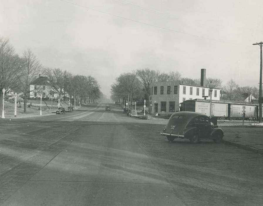 main street, Motorized Vehicles, Main Streets & Town Squares, train car, Iowa, correct date needed, Iowa History, Waverly, IA, railroad track, Cities and Towns, brick street, Waverly Public Library, cars, Businesses and Factories, history of Iowa