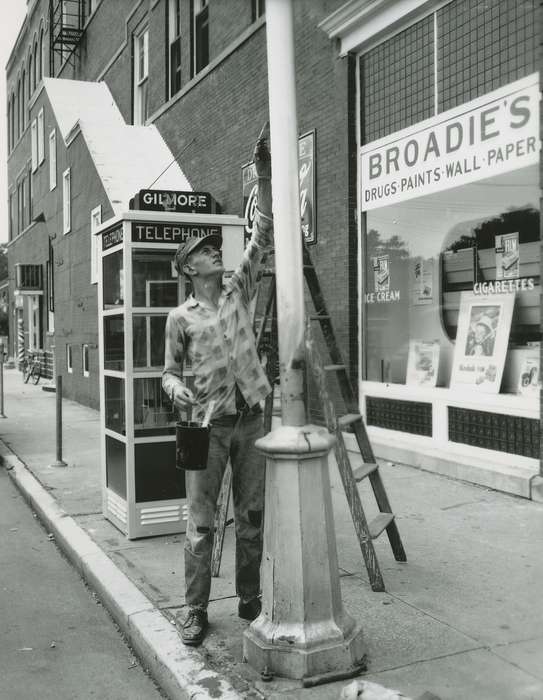 history of Iowa, Cities and Towns, storefront, Businesses and Factories, utility pole, Waverly Public Library, phone booth, painter, paint can, Iowa History, Iowa, general store, Main Streets & Town Squares, Labor and Occupations