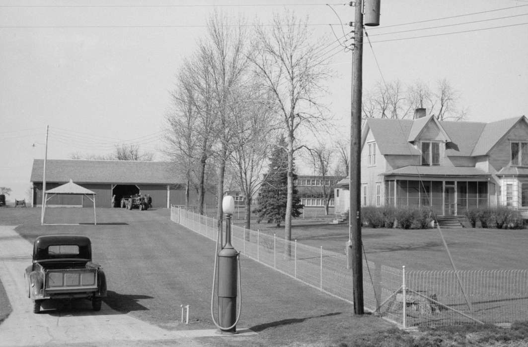 Homes, electrical pole, history of Iowa, Farms, Farming Equipment, pickup truck, tractor, tree line, Labor and Occupations, Iowa, farmhouse, Barns, Library of Congress, Motorized Vehicles, farmers, yard fence, gas pump, Iowa History