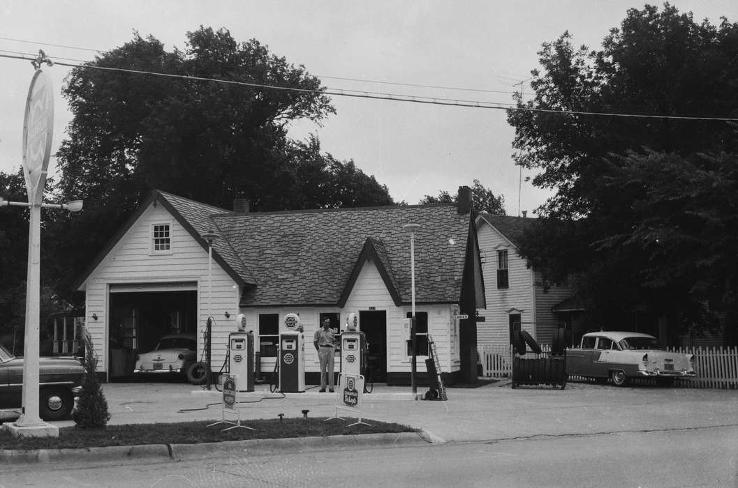 Businesses and Factories, history, Photos, Labor and Occupations, attendant, Iowa, IA, Cities and Towns, gas station, Motorized Vehicles, United States, ia, Coon Rapids Enterprise, historic, tires, automobile garage, cars, Coon Rapids, road sign