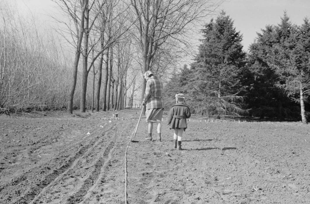 leafless trees, tree line, Labor and Occupations, Iowa, hoe, Families, Library of Congress, head scarf, gardening, history of Iowa, Children, Iowa History