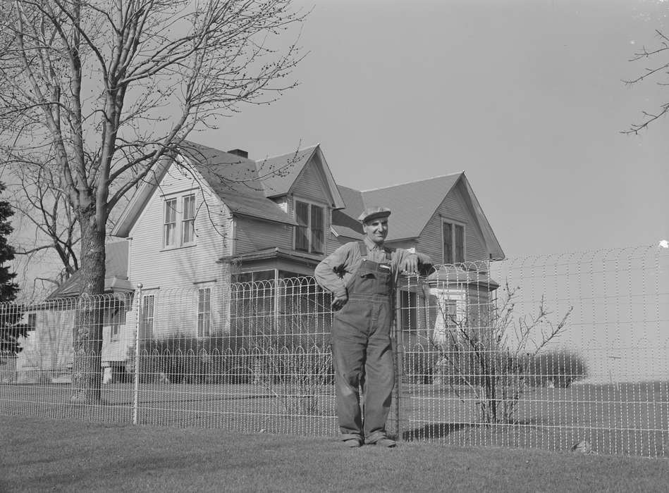 yard fence, farmhouse, Portraits - Individual, Leisure, Library of Congress, Labor and Occupations, overalls, Homes, Iowa, Iowa History, history of Iowa, farmer