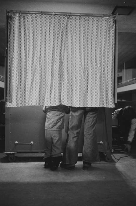 Lemberger, LeAnn, jeans, Ottumwa, IA, Civic Engagement, Iowa, Children, Iowa History, history of Iowa, vote, poling place, booth, curtain