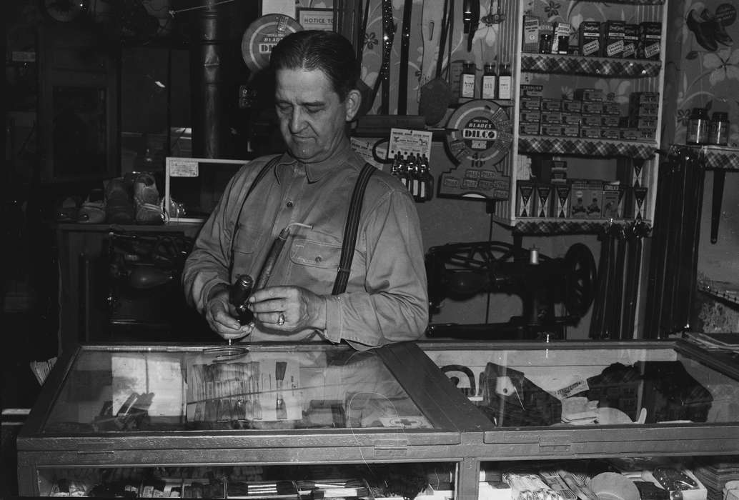 Businesses and Factories, Portraits - Individual, shoes, old man, United States, history, ia, display case, Photos, Labor and Occupations, suspenders, Coon Rapids Enterprise, historic, Iowa, IA, Coon Rapids, general store