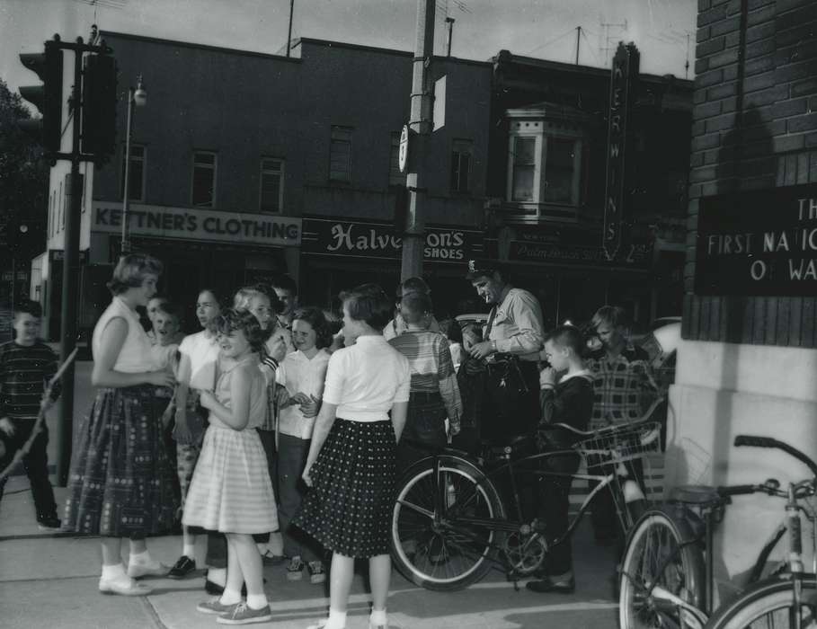 police officer, Iowa, Waverly Public Library, Civic Engagement, bikes, crowd, traffic light, storefront, correct date needed, Iowa History, history of Iowa, Children
