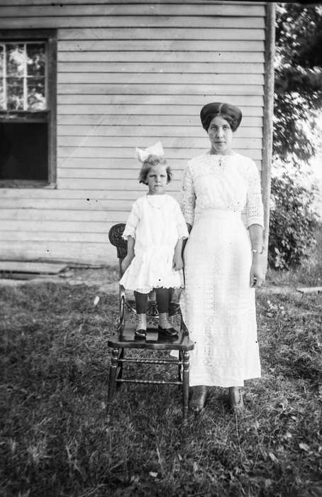bow, girl, history of Iowa, woman, high buttoned shoes, chair, Children, IA, Portraits - Group, hairstyle, Iowa, Iowa History, Anamosa Library & Learning Center, Families, dress