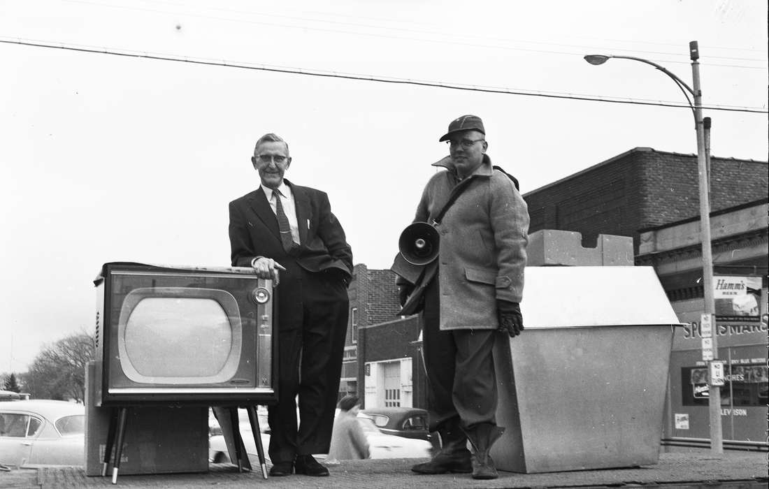 Portraits - Group, Businesses and Factories, United States, history, television, ia, Main Streets & Town Squares, businessman, winter coat, raffle drawing, megaphone, Coon Rapids Enterprise, Photos, historic, Iowa, IA, Coon Rapids