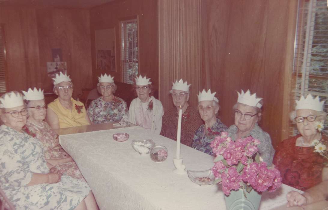 paper hats, Portraits - Group, fun, flowers, old woman, history of Iowa, floral, glasses, candy, table, party, new year's eve, hats, Holidays, USA, Iowa History, Iowa, Spilman, Jessie Cudworth, candle