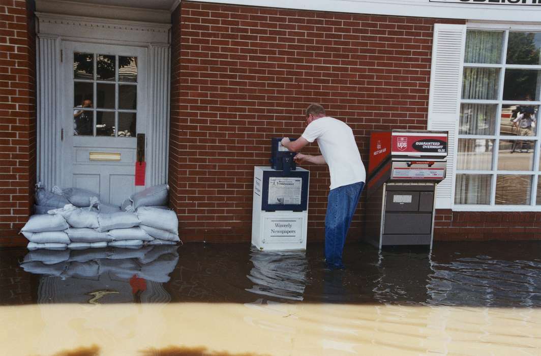 Waverly Public Library, Floods, Iowa History, jeans, Leisure, Waverly, IA, blue jeans, sandbag, ups, Iowa, history of Iowa, newspaper, water, Businesses and Factories
