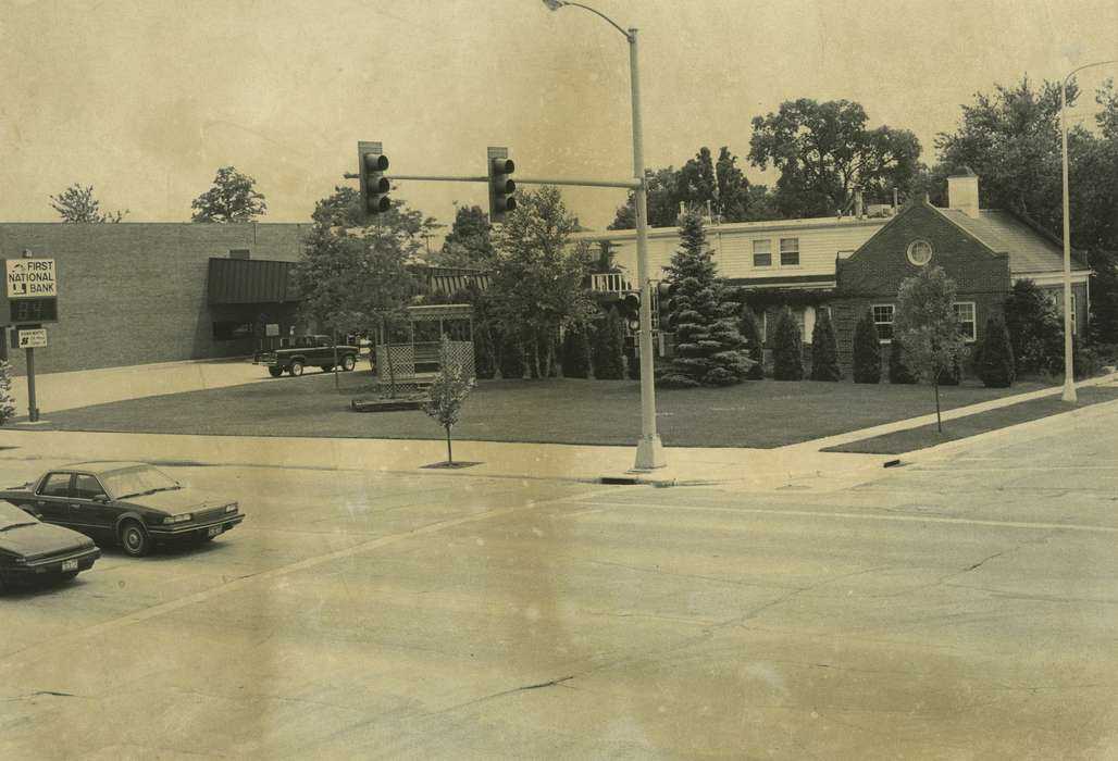 stoplight, first national bank, Motorized Vehicles, Main Streets & Town Squares, Iowa, correct date needed, Iowa History, pine trees, intersection, Waverly Public Library, Cities and Towns, cars, Businesses and Factories, Aerial Shots, history of Iowa