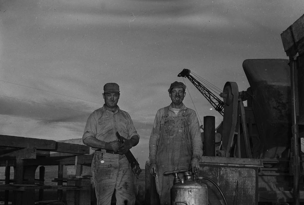 two men, Portraits - Individual, overalls, workers, United States, history, ia, Photos, Labor and Occupations, bridge construction, Coon Rapids Enterprise, smiles, historic, Iowa, IA, crane, Coon Rapids