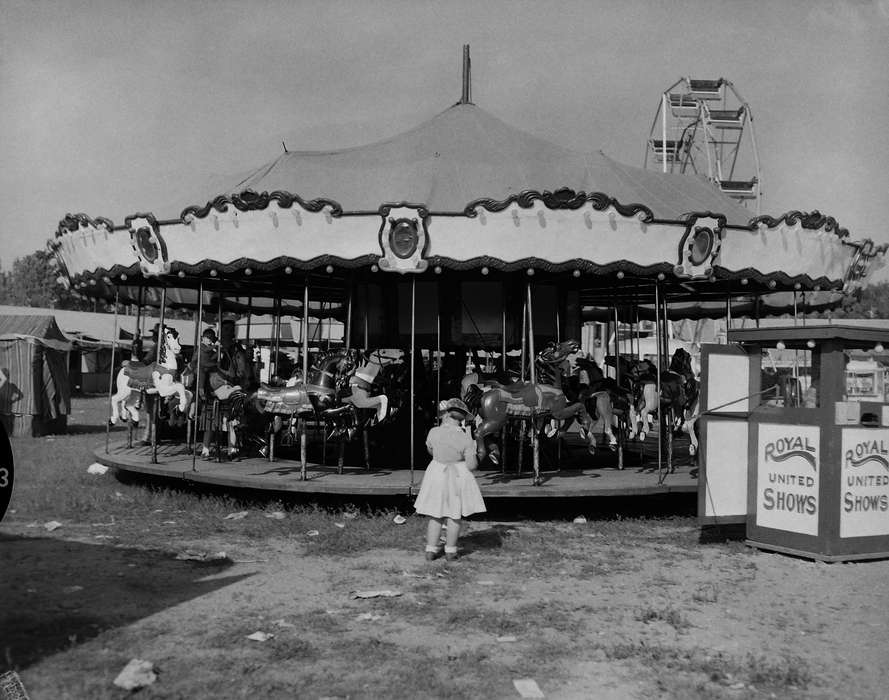amusement park ride, history, Photos, Outdoor Recreation, Children, county fair, Iowa, IA, Fairs and Festivals, Civic Engagement, merry-go-round, Portraits - Individual, girl, United States, ia, Entertainment, Leisure, Coon Rapids Enterprise, carnival ride, carousel, historic, Coon Rapids