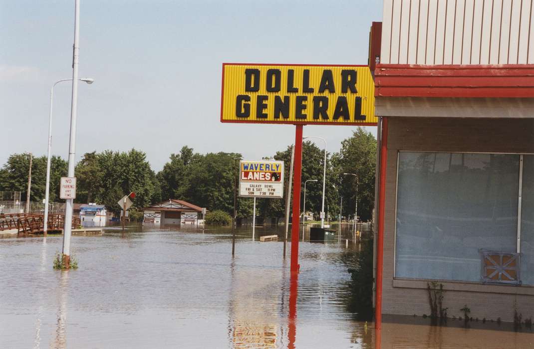 dollar store, Waverly Public Library, Main Streets & Town Squares, bowling alley, street light, Floods, history of Iowa, Cities and Towns, Iowa, street sign, Iowa History, bridge, bowling, water, Waverly, IA, Businesses and Factories, dollar general, main street