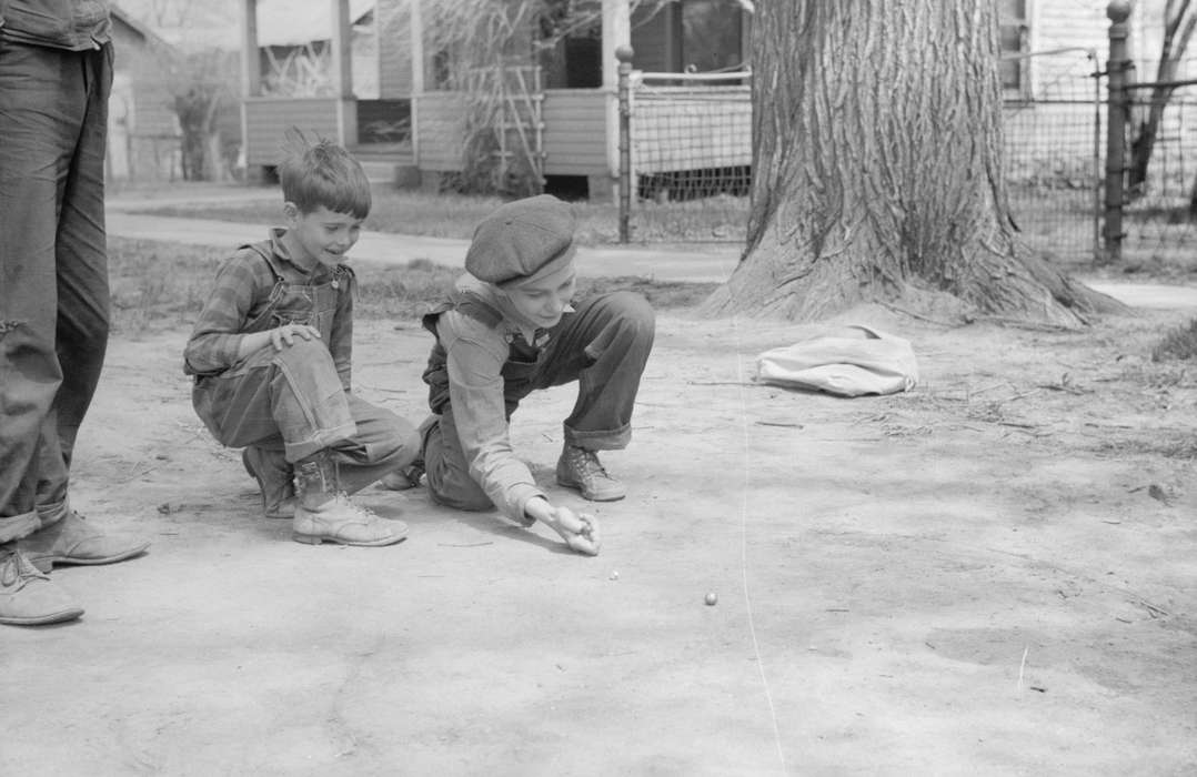 Homes, history of Iowa, newsboy hat, Library of Congress, overalls, Entertainment, Iowa History, children, Iowa, neighborhood, Families, Children, marbles, dirt road, Leisure