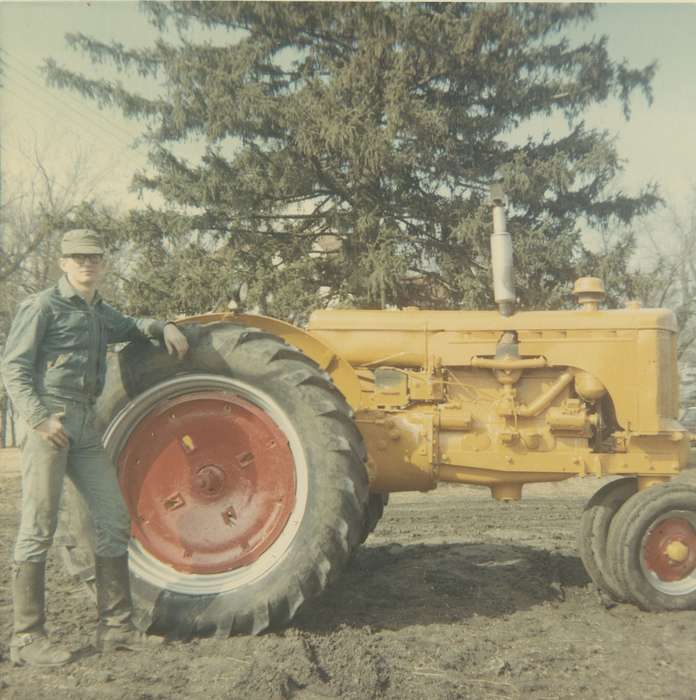 boots, Farming Equipment, Farms, tractor, Portraits - Individual, Iowa History, Malcolm, Cindy, mud, Iowa, Hansell, IA, Motorized Vehicles, history of Iowa, Labor and Occupations