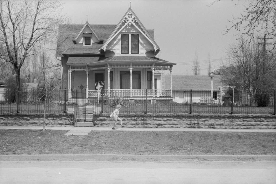 playing, history of Iowa, Library of Congress, Homes, metal gates, yard fence, Iowa History, girl, neighborhood, Main Streets & Town Squares, Cities and Towns, Iowa, Children, brick wall