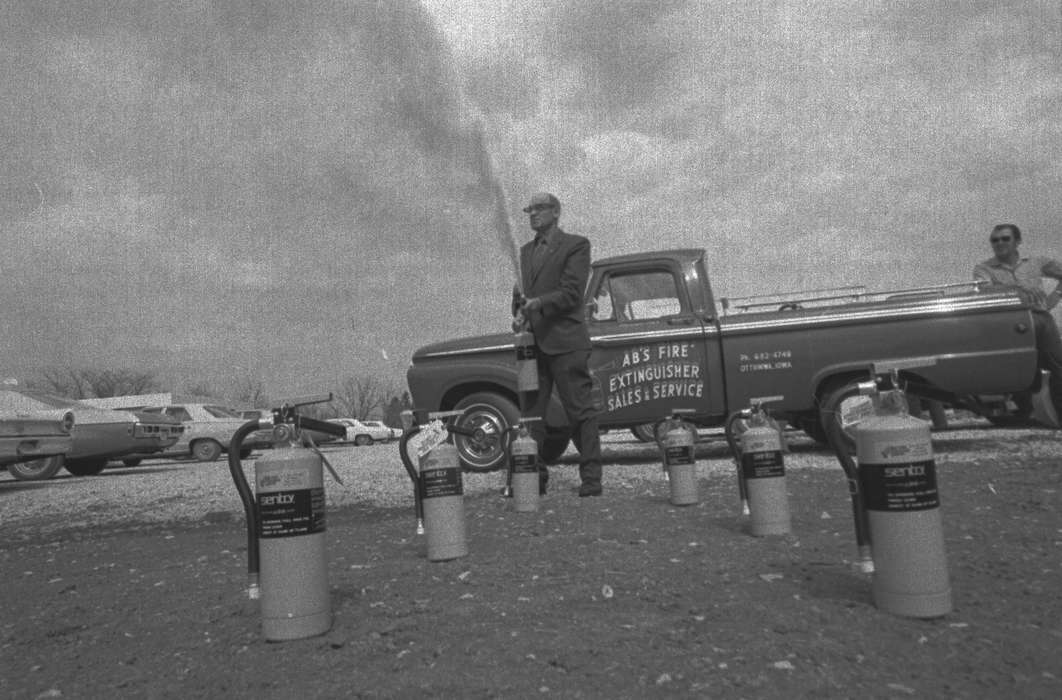 truck, parking lot, Lemberger, LeAnn, Iowa, Iowa History, history of Iowa, Motorized Vehicles, fire extinguisher, suit, spray, Ottumwa, IA, Businesses and Factories