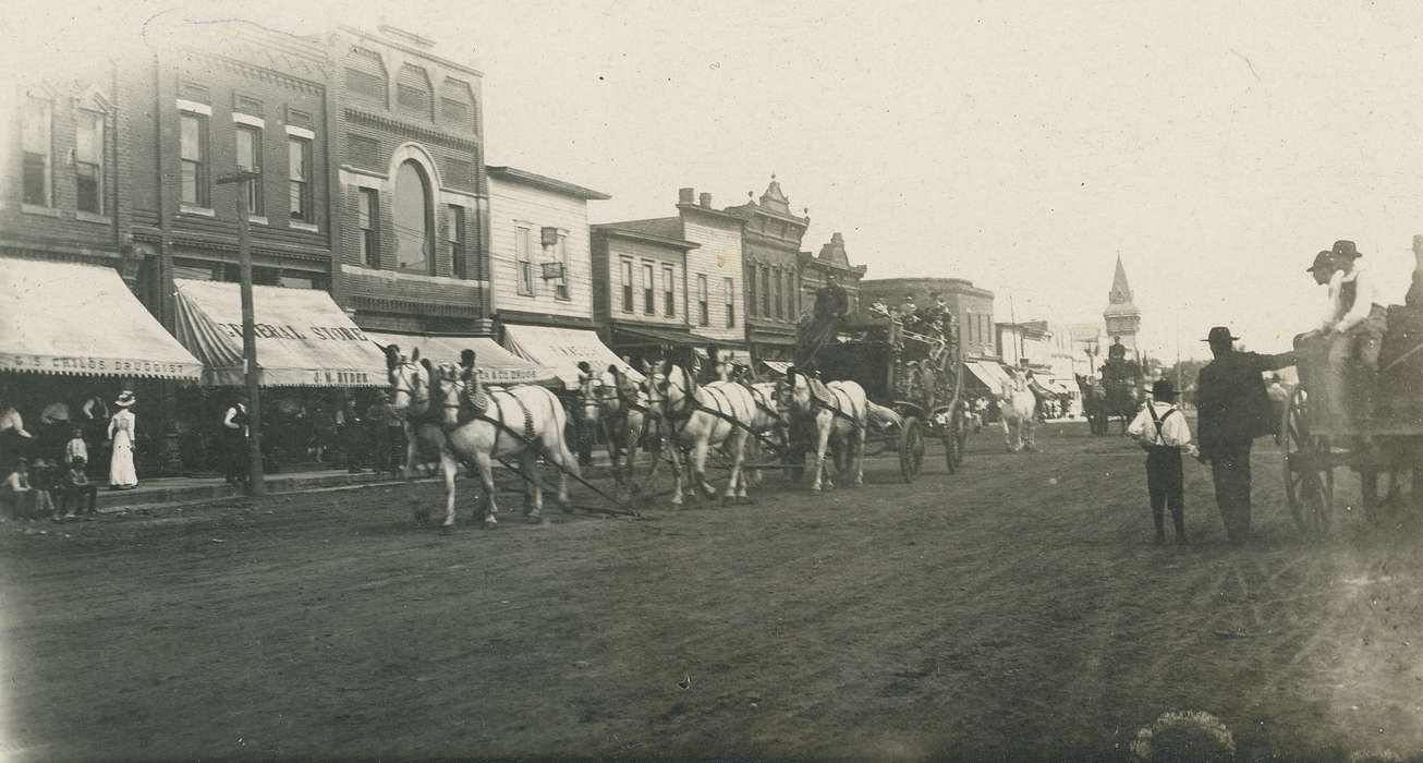 cart, horse, Animals, correct date needed, Businesses and Factories, Cities and Towns, Families, Entertainment, Children, dirt road, Portraits - Group, Main Streets & Town Squares, Coon Rapids Enterprise, awning, brick building