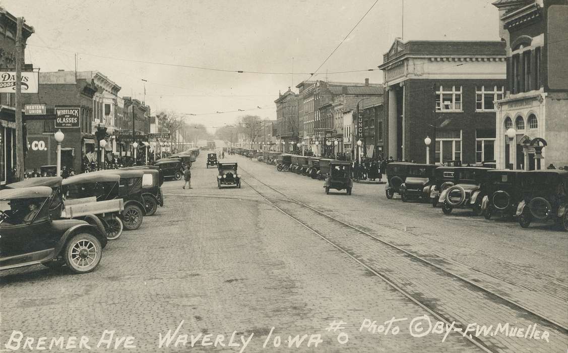 tracks, Iowa History, brick road, tire, wheels, Meyer, Mary, tires, street, Motorized Vehicles, car, windows, model t, light, ford, power lines, Iowa, history of Iowa, cars, Main Streets & Town Squares, Cities and Towns, lamppost