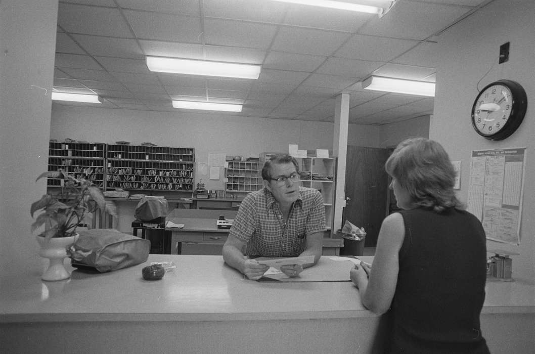 Lemberger, LeAnn, clerk, glasses, mail, Cities and Towns, post office, Melrose, IA, history of Iowa, clock, Iowa, Iowa History, postmaster, Businesses and Factories, houseplant