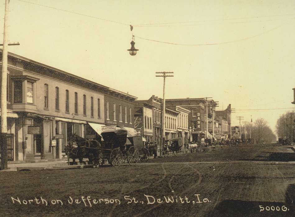 dirt street, DeWitt, IA, Main Streets & Town Squares, storefront, Saliu, Becky, horse, Iowa History, horse and buggy, shop, store, Cities and Towns, Animals, Iowa, history of Iowa