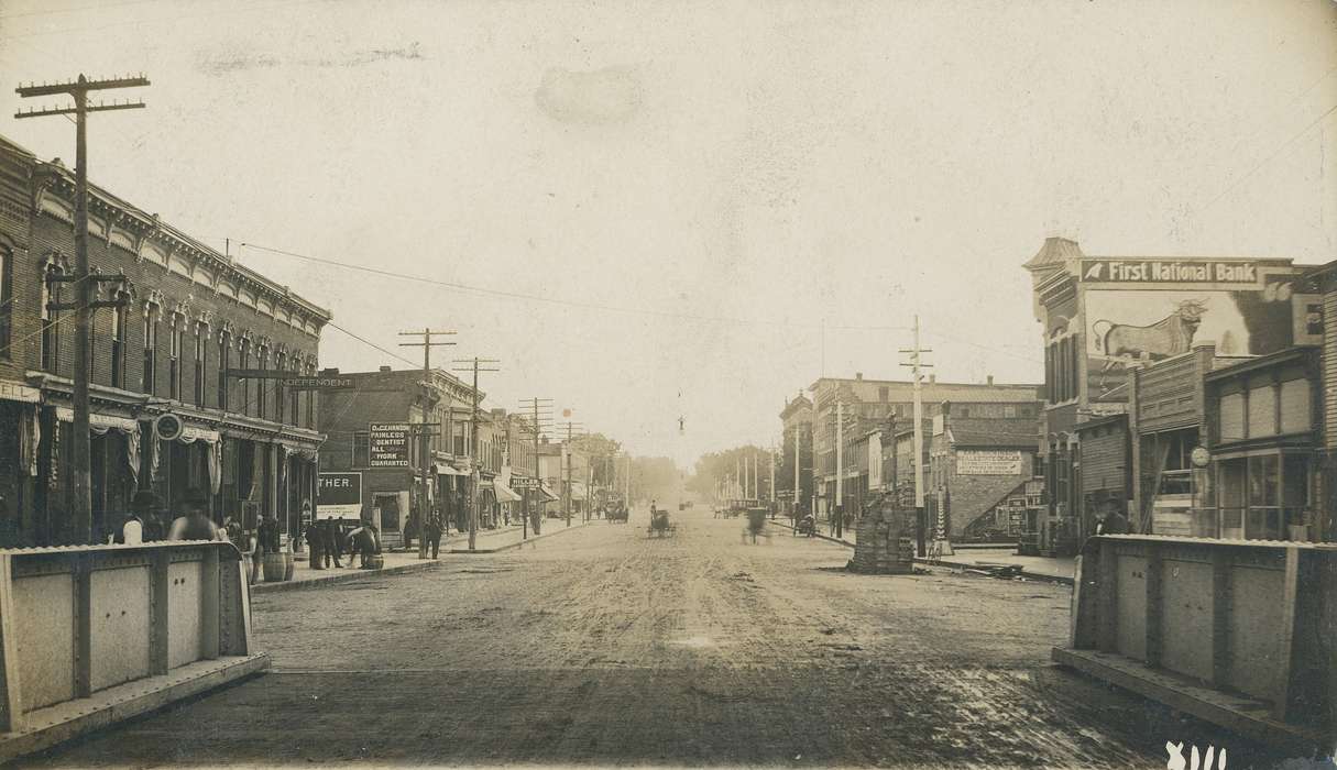 buildings, wizard of wall street, street, telephone line, Meyer, Mary, Iowa History, barrel, Iowa, history of Iowa, Cities and Towns, building, dirt road, carriage, Main Streets & Town Squares