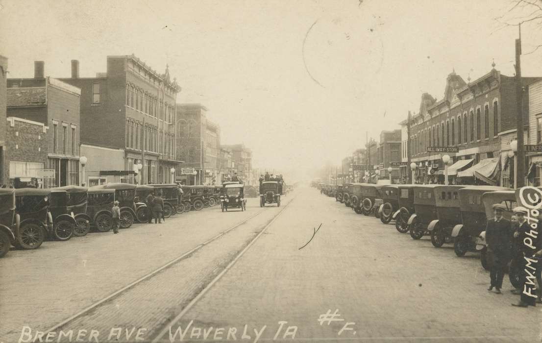 awning, building, cars, buildings, Meyer, Mary, Cities and Towns, Main Streets & Town Squares, storefront, car, Iowa History, Iowa, street, history of Iowa, track, trolley, tracks, Motorized Vehicles