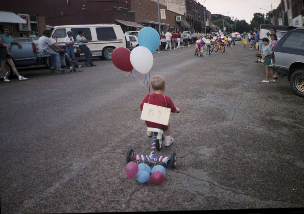 Main Streets & Town Squares, summer, balloons, parade, DeGroot, Kathleen, Cities and Towns, Iowa, Iowa History, Holidays, history of Iowa, Parkersburg, IA, tricycle