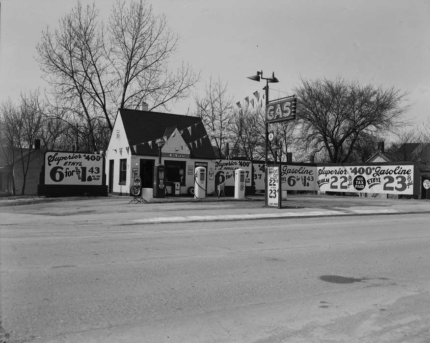 Businesses and Factories, Labor and Occupations, Iowa History, sign, Iowa, gas pump, Ottumwa, IA, flag, Lemberger, LeAnn, Main Streets & Town Squares, street, advertisement, history of Iowa, gas station