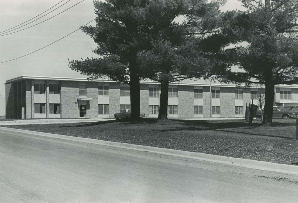 pine trees, Waverly Public Library, nursing home, history of Iowa, Cities and Towns, Homes, car, Iowa, Iowa History, Motorized Vehicles, correct date needed, brick building, Hospitals