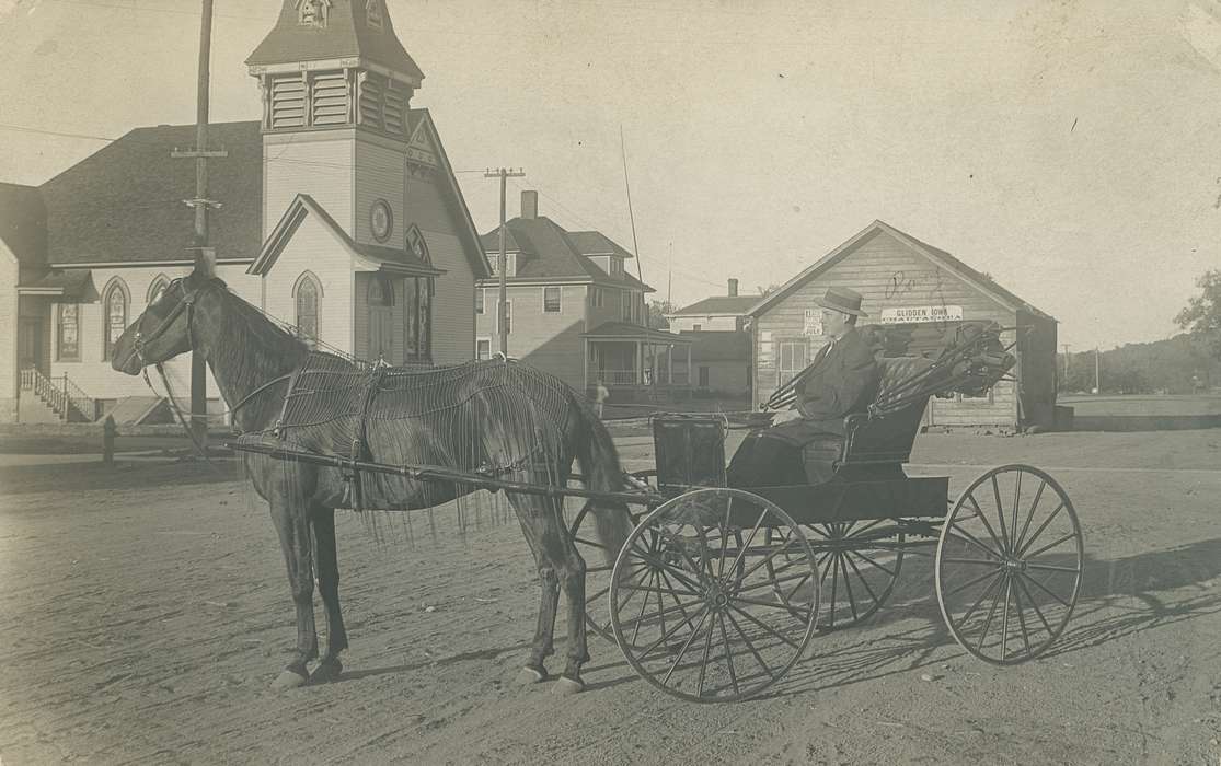 buggy, Portraits - Individual, horse, Animals, power line, hat, correct date needed, Businesses and Factories, Cities and Towns, Coon Rapids Enterprise, dirt road, Main Streets & Town Squares, Religious Structures