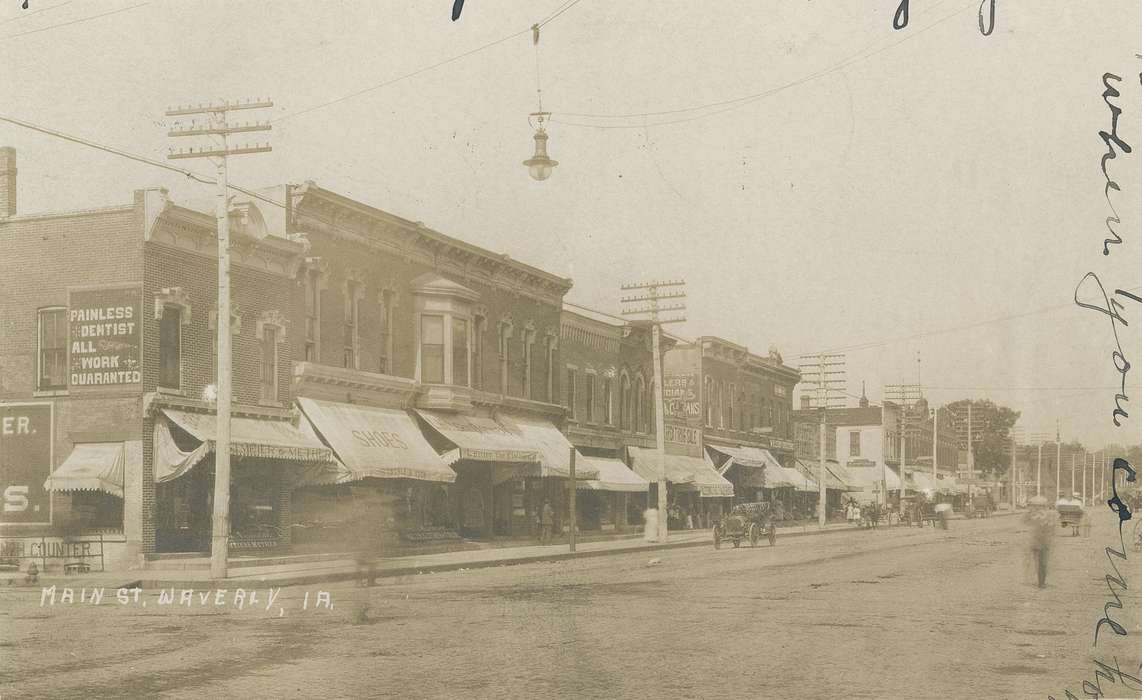 buildings, dirt road, Meyer, Mary, telephone line, Iowa History, awning, Iowa, street lamp, sidewalk, history of Iowa, Cities and Towns, storefront, side walk, Businesses and Factories, Main Streets & Town Squares