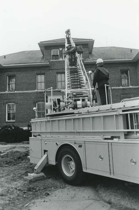 Motorized Vehicles, roof, cross, history of Iowa, Religion, Civic Engagement, ladder, fire truck, Waverly Public Library, dirt, Iowa, Waverly, IA, Labor and Occupations, Iowa History, helmet