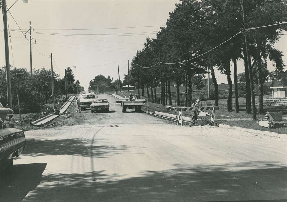 cars, Cities and Towns, road construction, construction crew, trees, correct date needed, Waverly Public Library, Iowa History, power lines, construction equipment, Iowa, Motorized Vehicles, history of Iowa, Labor and Occupations
