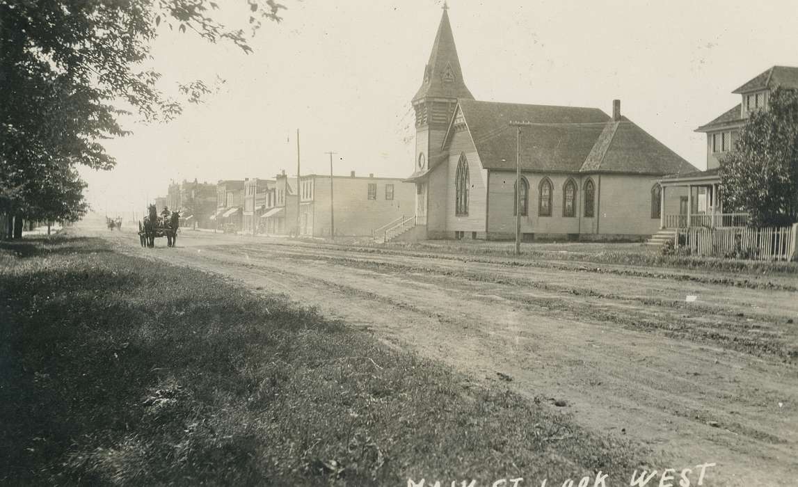 bell tower, horse, Animals, Homes, correct date needed, Businesses and Factories, Cities and Towns, Coon Rapids Enterprise, dirt road, Portraits - Group, Main Streets & Town Squares, Religious Structures, awning, brick building