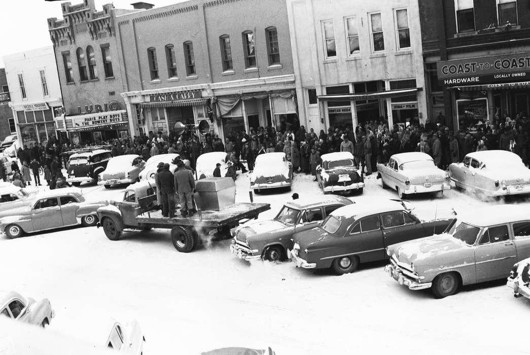Businesses and Factories, cinema, storefronts, history, Holidays, Photos, snow, crowd, Iowa, IA, Cities and Towns, Motorized Vehicles, United States, ia, raffle drawing, Coon Rapids Enterprise, historic, cars, Coon Rapids, flatbed trailer