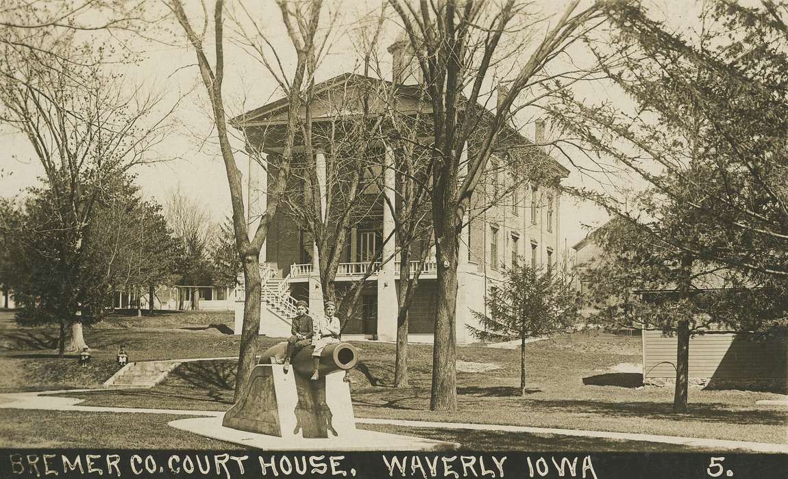 column, columns, history of Iowa, trees, Iowa, boys, court, Main Streets & Town Squares, cannon, Cities and Towns, kids, boy, architecture, Iowa History, courthouse, Children, Meyer, Mary, Prisons and Criminal Justice