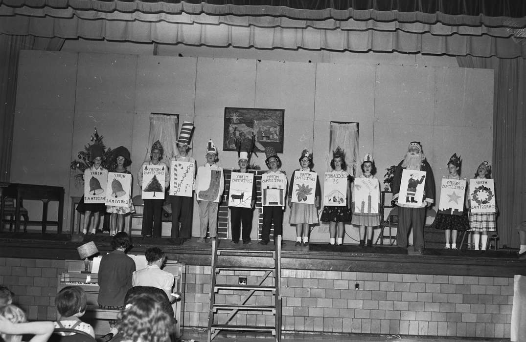 Portraits - Group, Schools and Education, santa claus, Holidays, costumes, Photos, stage, history, Children, Iowa, IA, christmas tree, piano, United States, ia, Entertainment, Coon Rapids Enterprise, historic, performance, paper hats, Coon Rapids