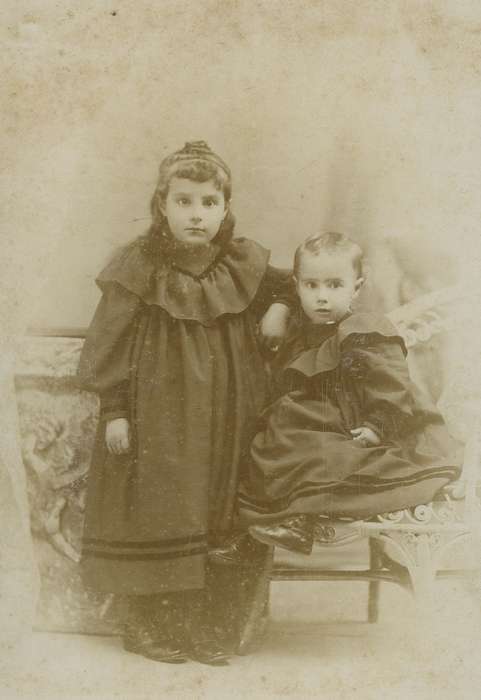 siblings, cabinet photo, high buttoned shoes, children, correct date needed, Olsson, Ann and Jons, girls, history of Iowa, Iowa History, Portraits - Group, Iowa, sisters, Waterloo, IA, wicker chair, Children