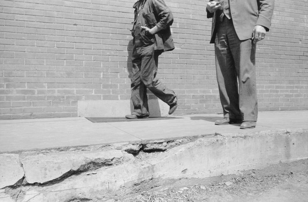 sidewalk, Cities and Towns, brick building, work clothes, Iowa History, history of Iowa, broken sidewalk, Portraits - Group, Library of Congress, man, Iowa, suit