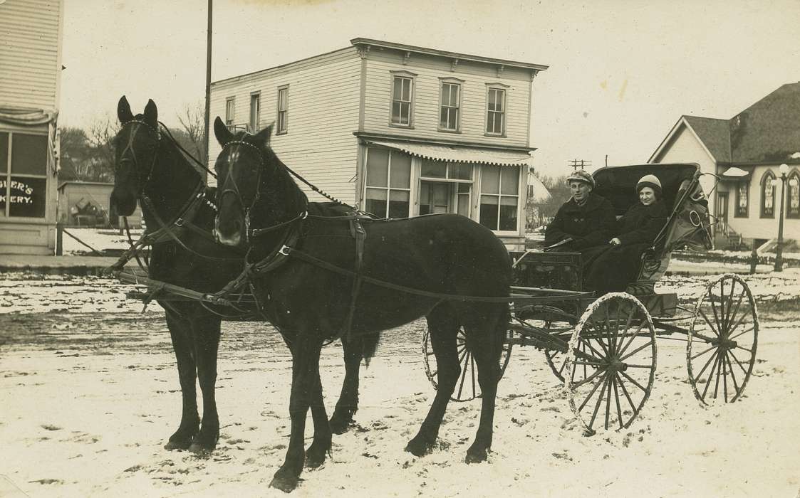 buggy, horse, street lamp, Businesses and Factories, Cities and Towns, Families, snow, Coon Rapids Enterprise, dirt road, Portraits - Group, Main Streets & Town Squares, Leisure, Winter
