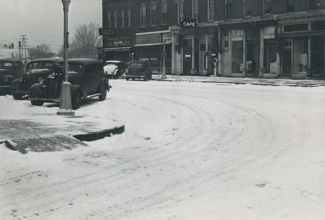 history of Iowa, power line, Main Streets & Town Squares, cafe, Iowa, street light, Iowa History, Businesses and Factories, snow, leather shop, Motorized Vehicles, barbershop, Waverly, IA, Waverly Public Library, car, Winter