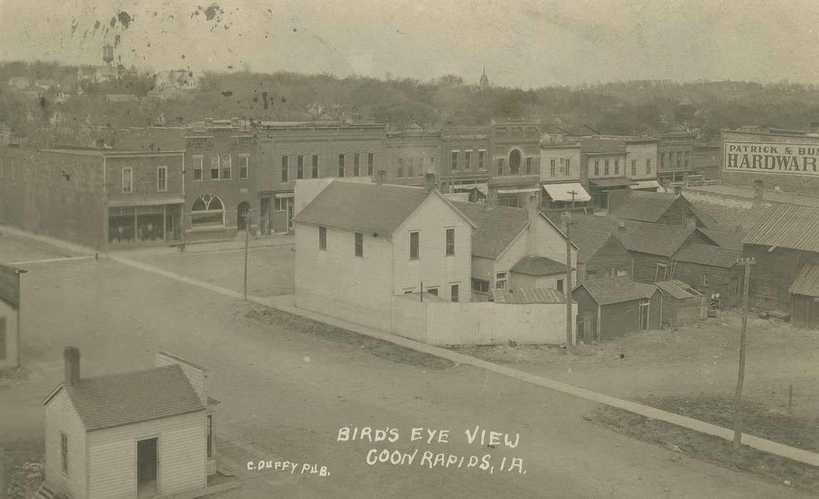Aerial Shots, Homes, power line, Businesses and Factories, Cities and Towns, Coon Rapids Enterprise, dirt road, Main Streets & Town Squares, awning, brick building