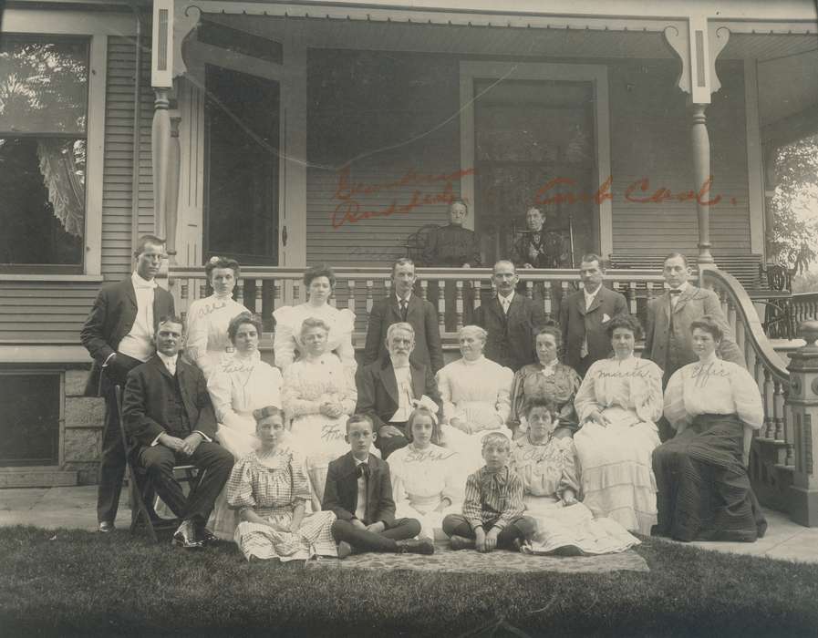 Waverly Public Library, suit, woman, Iowa History, bench, moustache, history of Iowa, Homes, Portraits - Group, front porch, Families, railing, wooden house, Children, Iowa, sidney curtis, man