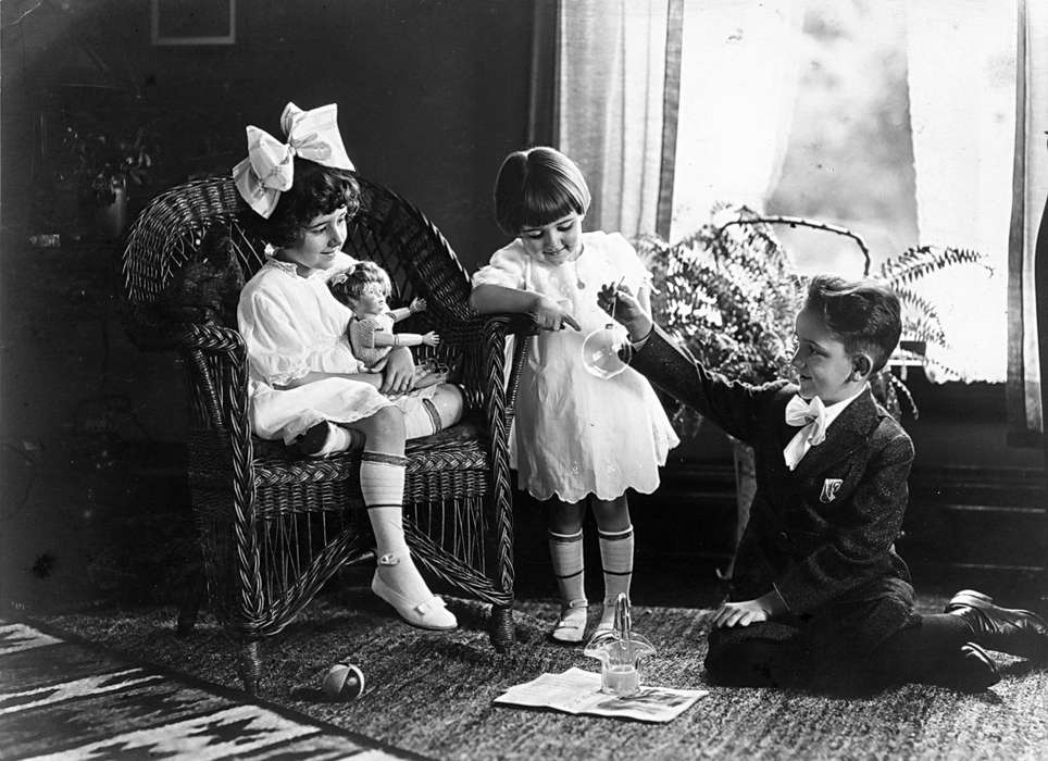 sisters, Children, Scherrman, Pearl, ornament, Iowa History, glass, ball, history of Iowa, Portraits - Group, siblings, wicker, Homes, ornaments, brother, Early, IA, playing, Iowa, wicker chair, hair bow, doll