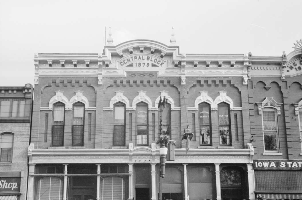 electrical pole, Library of Congress, Main Streets & Town Squares, Cities and Towns, Businesses and Factories, dentist's office, Iowa History, history of Iowa, lamppost, Iowa, brick building, power lines